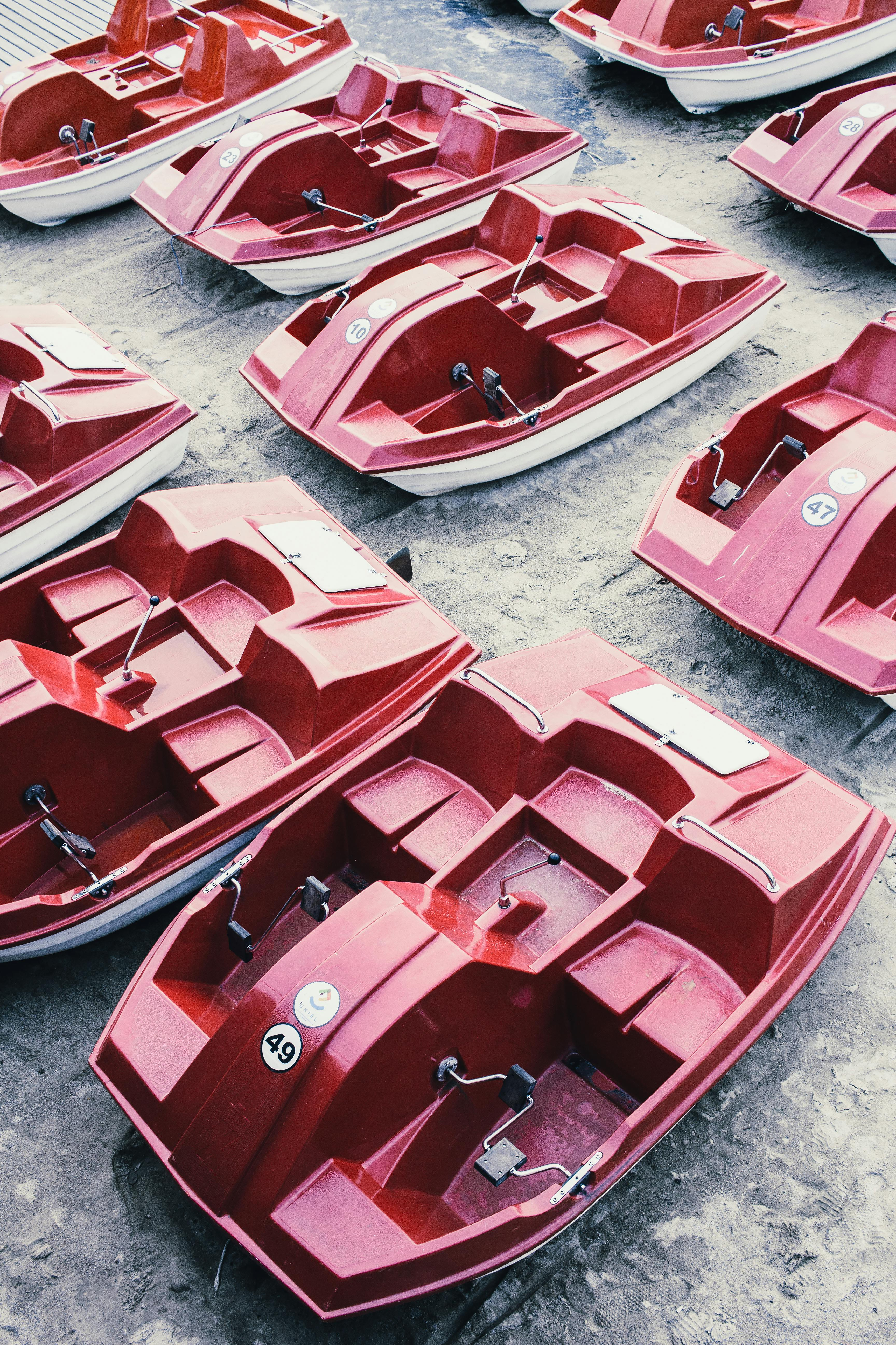 Multiple red boats lined up to represent expansion across a larger service operation